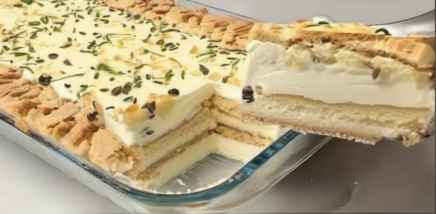 Delicious and simple 4-ingredient dessert featuring layers of creamy condensed milk and lemon juice mixture, soft moistened cookies, topped with crushed cookies and lemon zest, all set in an elegant serving dish