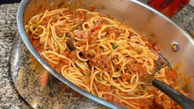 Delicious One-Pot Spaghetti Bolognese with ground beef, topped with grated Parmesan cheese, ready to be served