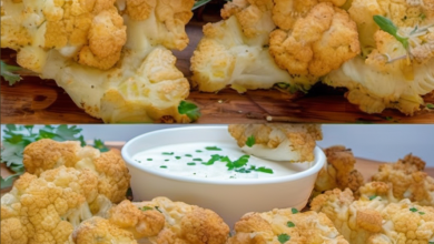 Crispy oven-roasted cauliflower florets with a golden-brown crust served on a white plate, accompanied by a small bowl of herb sauce, garnished with fresh parsley, ready to be enjoyed as a delicious and healthy dish