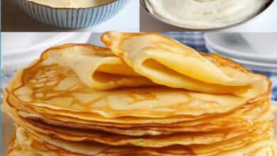 Stack of fluffy yoghurt pancakes topped with honey and fresh berries, served on a white plate