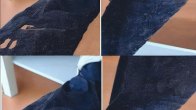 Detailed view of a person treating a bleach stain on a colorful fabric with a specialized solution, highlighting the process of stain removal.