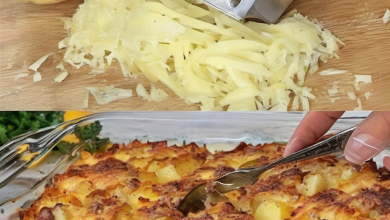 A golden-brown potato bake fresh out of the oven, garnished with herbs, served in a rustic dish on a wooden table, illustrating an affordable and tasty meal.