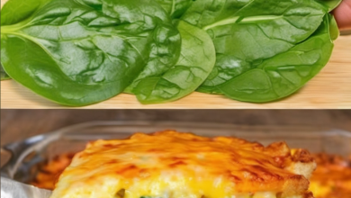 A healthy skillet meal with vibrant green spinach, sunny-side-up eggs, and melted cheese, served hot and fresh in a cooking pan, ideal for a nutritious breakfast or dinner