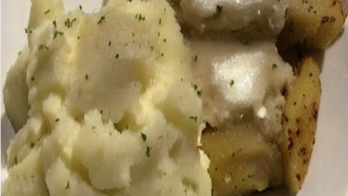 Creamy mashed potatoes made with chicken stock, topped with butter and herbs.