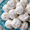 Delicious buttery pecan snowball cookies coated in powdered sugar, perfect for holiday treats