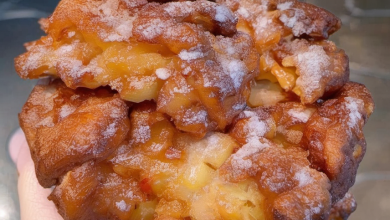 Freshly made apple fritters glazed with a sweet vanilla icing, perfect for a nostalgic treat