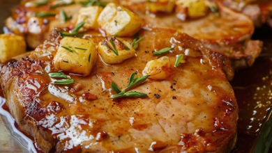 Delicious Supreme Pork Chops with creamy mushroom sauce and potatoes, served in a casserole dish