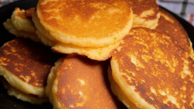 For the best results, use an image of a plate of golden, crispy Southern Cornmeal Hoecakes topped with a dollop of butter, alongside a pot of honey and a sprig of parsley for garnish.