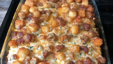 A hearty and delicious Tater Tot breakfast casserole with cheese, sausage, and eggs, baked to golden perfection in a 9x13-inch dish