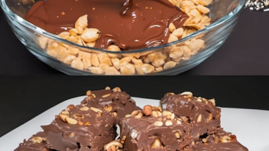 A delicious, no-bake chocolate and nut dessert, sliced into bars, topped with a smooth chocolate glaze and sprinkled with ground peanuts