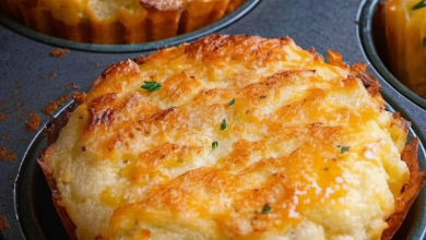 Mixing mashed potatoes with cheese and herbs to create savory muffin batter, perfect for a quick snack