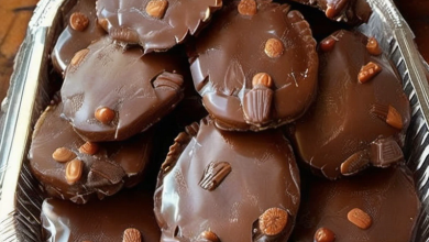 Arranging pecan halves on a baking sheet for homemade Turtle Candies