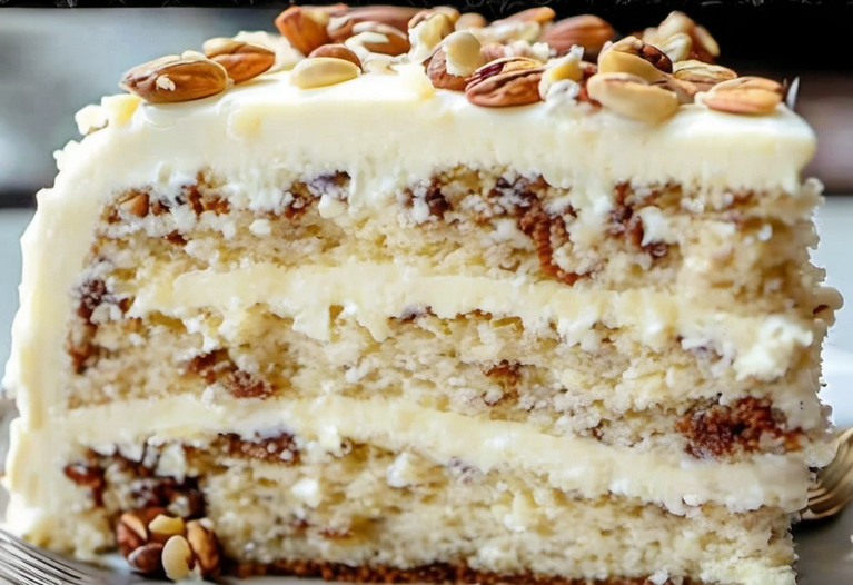 Layering and frosting Quick Italian Cream Cake with creamy cheese frosting and toasted nuts