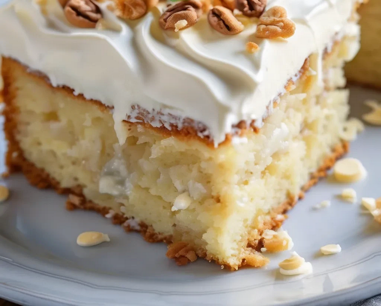 Layering and frosting Quick Italian Cream Cake with creamy cheese frosting and toasted nuts