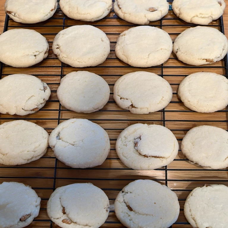 Mixing butter and sugar to create the base for delicious pecan butter cookies