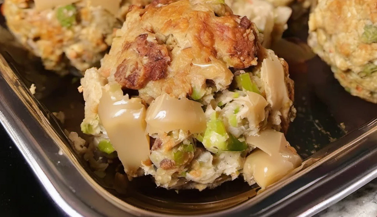 Mixing leftover stuffing and turkey to create delicious stuffing balls.