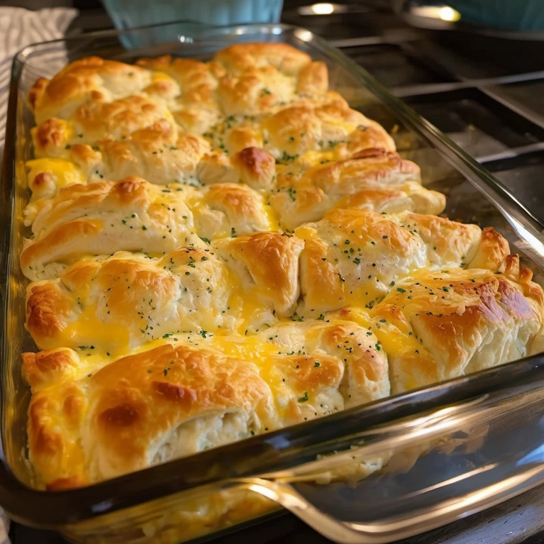 Golden brown Chicken Bubble Biscuit Bake with melted cheddar cheese on top, fresh out of the oven