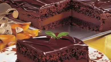 Rich and moist chocolate cake with smooth chocolate cream filling and a decadent frosting