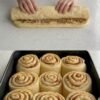 Tender yeast rolls filled with cinnamon, sugar, and toasted walnuts, finished with a tangy cream cheese frosting that melts into the swirls.