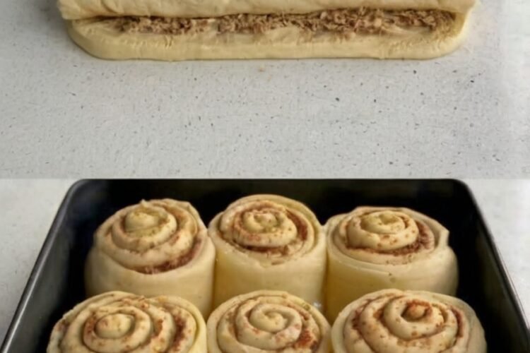 Tender yeast rolls filled with cinnamon, sugar, and toasted walnuts, finished with a tangy cream cheese frosting that melts into the swirls.