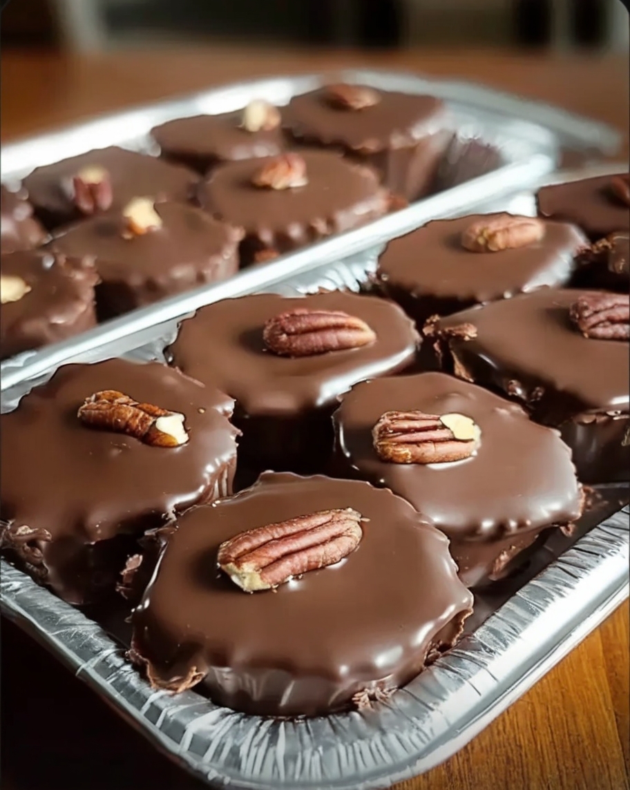 A plate of homemade turtle candy featuring pecan clusters, gooey caramel, and a smooth chocolate coating—perfect for gifting or snacking