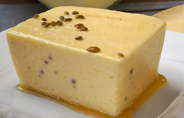 Homemade passion fruit cream dessert served chilled with a garnish of vibrant passion fruit seeds, illustrating a perfect blend of health and taste.