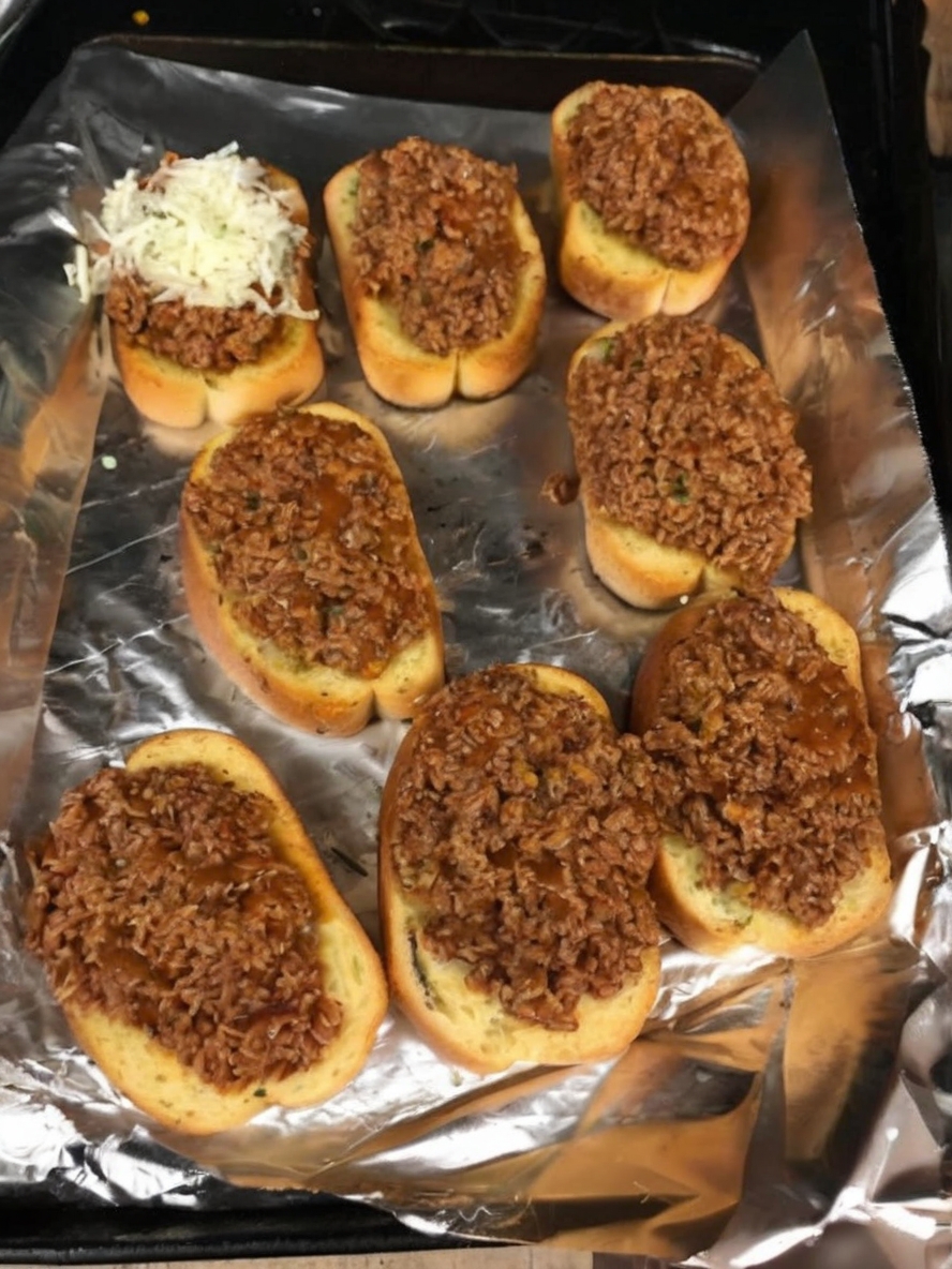 Garlic bread topped with seasoned ground beef, perfect for a quick and hearty meal