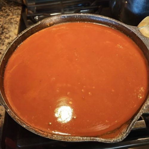 A bold, smoky red chili sauce perfect for enchiladas, tacos, and chilaquiles.