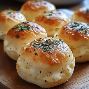 Buttery biscuit dough stuffed with gooey mozzarella cheese, brushed with garlic butter, and baked to golden perfection.