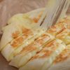 A quick and easy cheese potato bread with a crispy crust and gooey cheese filling, made in a frying pan.