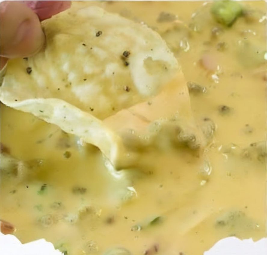 A creamy, cheesy, meaty dip made with Velveeta, cream cheese, Rotel, and sausage or ground beef—perfect for parties and game days.