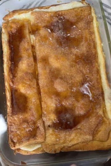 A rich, creamy cheesecake layered with flaky crescent dough and topped with cinnamon sugar. Easy, decadent, and crowd-pleasing!