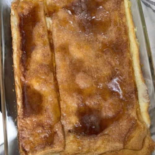 A rich, creamy cheesecake layered with flaky crescent dough and topped with cinnamon sugar. Easy, decadent, and crowd-pleasing!