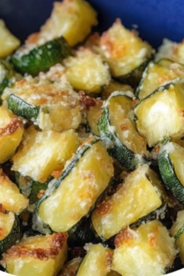 Crispy, tender zucchini cubes seasoned with garlic, Italian herbs, and Parmesan cheese—quickly cooked in the air fryer.