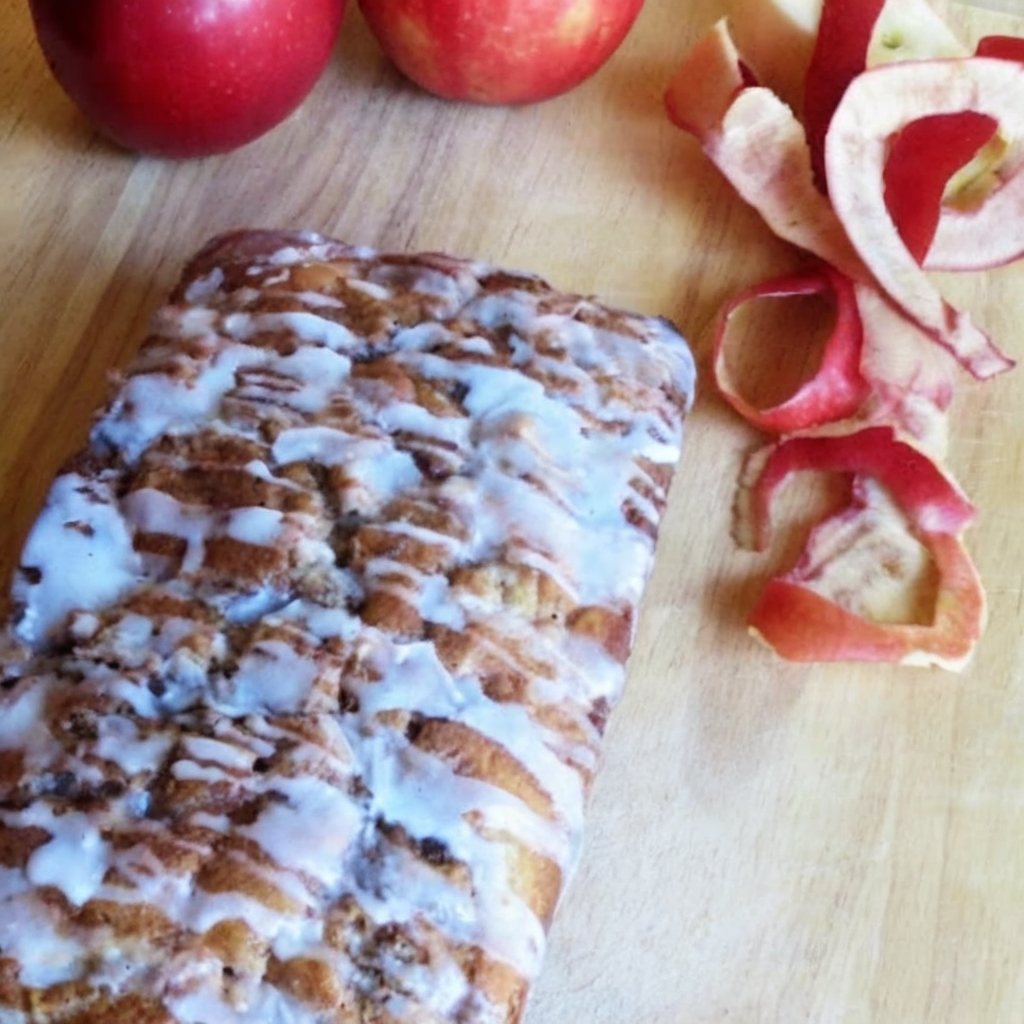 This apple fritter bread is filled with chopped apples and warm cinnamon, then topped with a sweet glaze for the ultimate bakery-style treat.