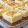 A tangy, creamy dessert bar made with a buttery graham cracker crust and a bright lemon cheesecake filling.
