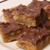 Rich caramel, crunchy pecans, buttery crust, and melty chocolate come together in these indulgent dessert bars.