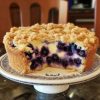 If you’ve been craving the perfect coffee cake to serve with your morning brew or impress guests at brunch, this Blueberry Cream Cheese Crumb Cake is the one