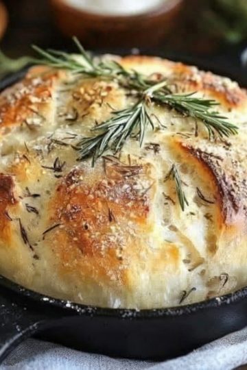 A crusty, flavorful artisan bread made with garlic and rosemary—no kneading required! Perfect for beginners and can be baked in the oven or air fryer.