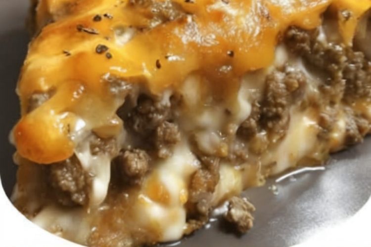 This easy and hearty Cheeseburger Pie is a family favorite with a rich, savory beef filling, creamy cheese topping, and a golden, biscuit-like crust. Perfect for busy weeknights or casual dinners!