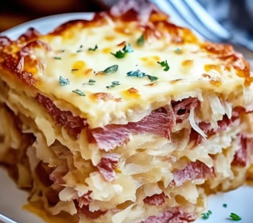 This Easy Reuben Bake combines tender corned beef, tangy sauerkraut, creamy Swiss cheese, and zesty Thousand Island dressing—all baked into a buttery