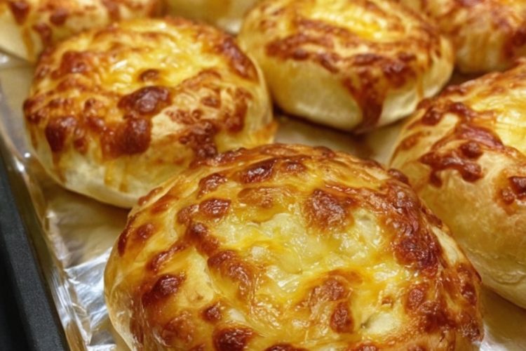 Soft, fluffy rolls topped with crispy golden cheddar cheese, perfect for every meal or snack.