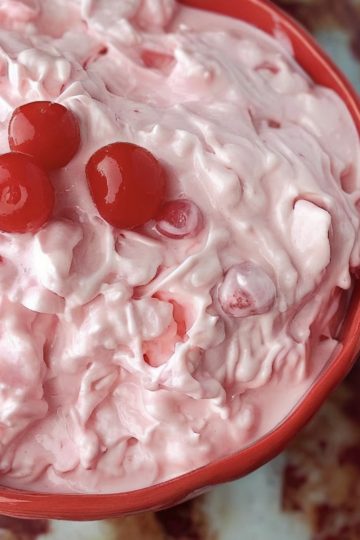 Sweet, creamy, and fluffy dessert packed with pineapple, marshmallows, and optional cherries or coconut.