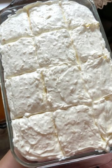 A Southern-style citrus cake made with yellow cake mix, mandarin oranges, pineapple, and whipped topping. Refreshing, creamy, and crowd-approved!