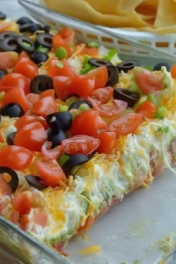 Seven layers of Tex-Mex goodness—beans, crema, salsa, avocado, cheese, and all your favorite toppings!