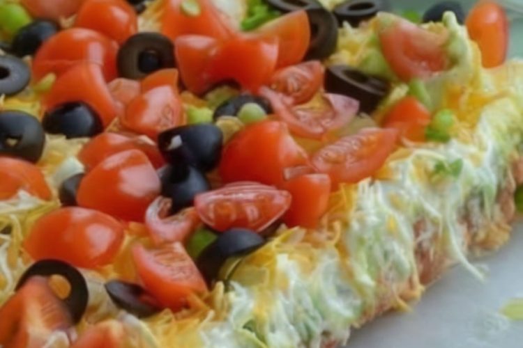 Seven layers of Tex-Mex goodness—beans, crema, salsa, avocado, cheese, and all your favorite toppings!
