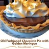 Silky chocolate custard nestled in a crisp crust, topped with sweet, toasty meringue—pure comfort dessert.