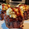 These adorable meatloaf cupcakes are bursting with flavor and topped with creamy mashed potato frosting. Perfect for family dinners or party appetizers!