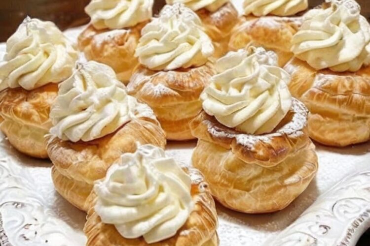 Light, airy choux pastry shells filled with silky vanilla pudding whipped cream. This bakery-style dessert is easy to make and impossible to resist!