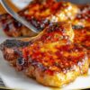 Try this easy pork chop recipe tonight and enjoy the perfect blend of sweet, savory, and sticky that makes weeknight dinners exciting again! Who will you invite over to share these delicious chops?